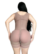 Person wearing a beige body shaper in a room.